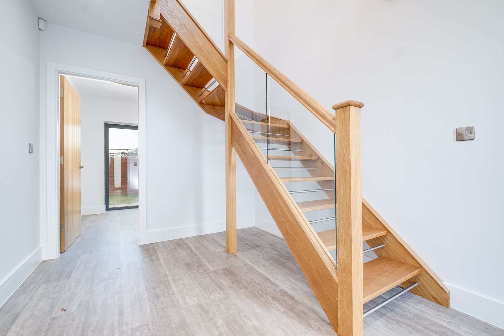 Bespoke open tread stairs with glass balustrade