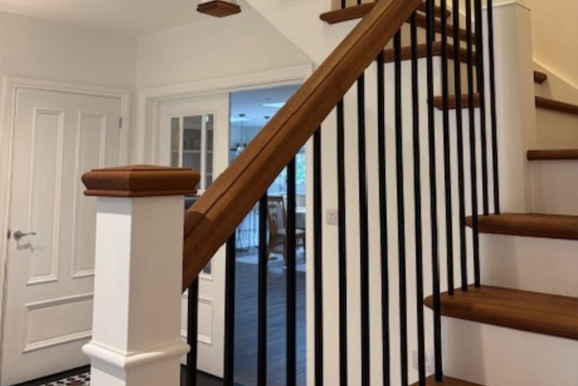 Lamp black bespoke cut string staircase