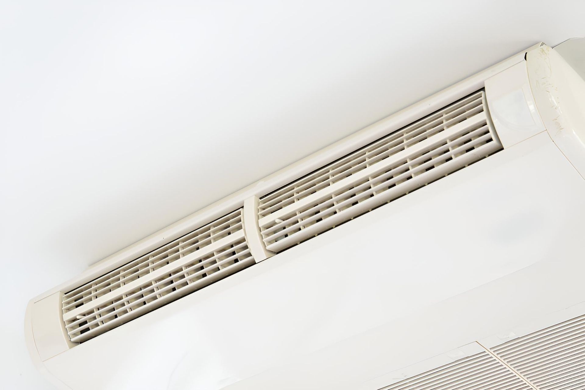 White Air Conditioner is Mounted — Robbie McDonald Electrical in Nambour, QLD