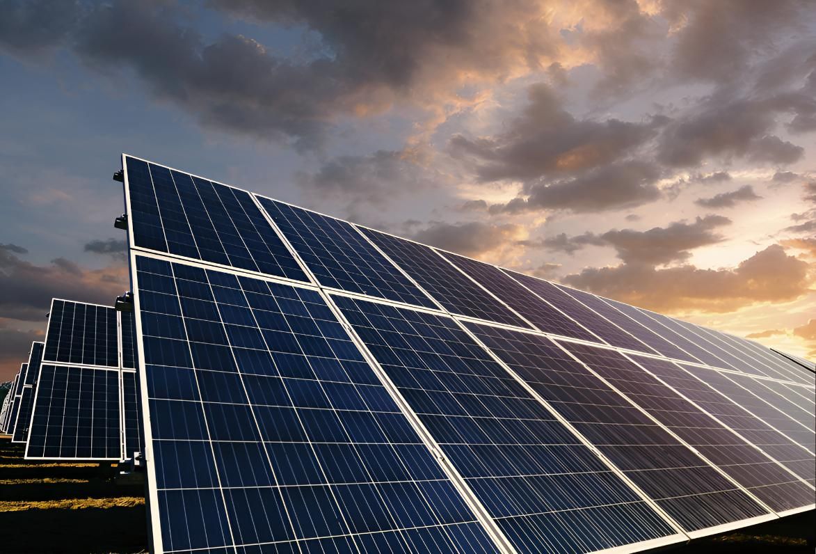 Row of Solar Panels Against a Cloudy Sky — Robbie McDonald Electrical in Sippy Downs, QLD
