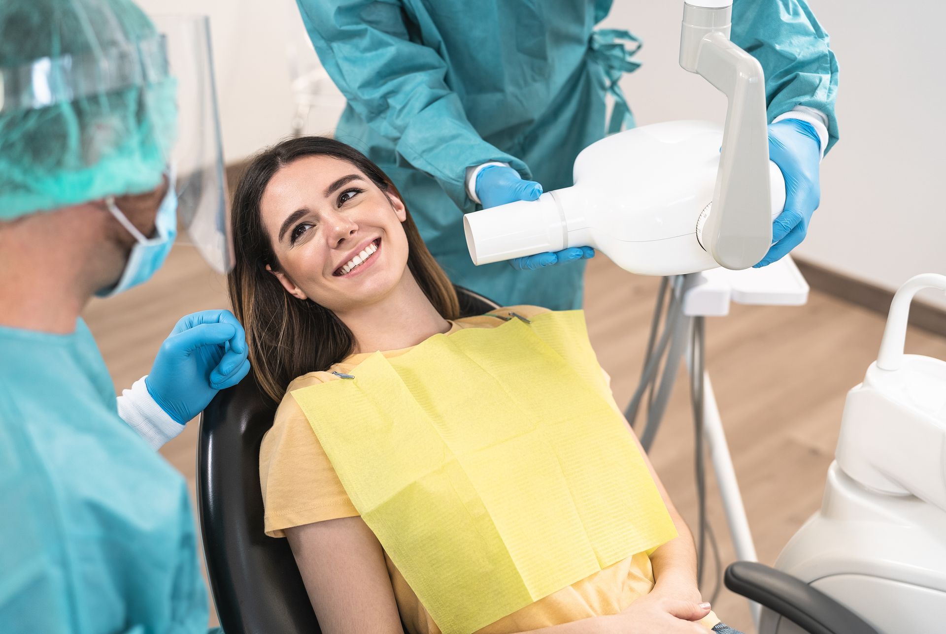 Patient undergoing a routine dental checkup in a dental office.
