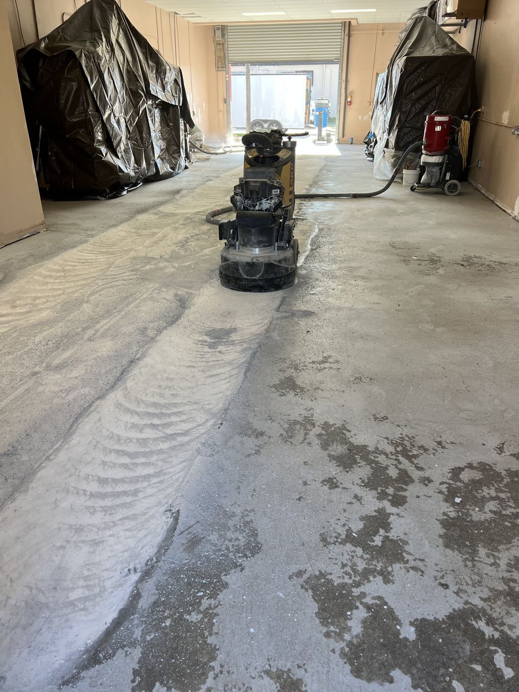 Concrete surface preparation service before epoxy flooring installation in Southwest Florida.