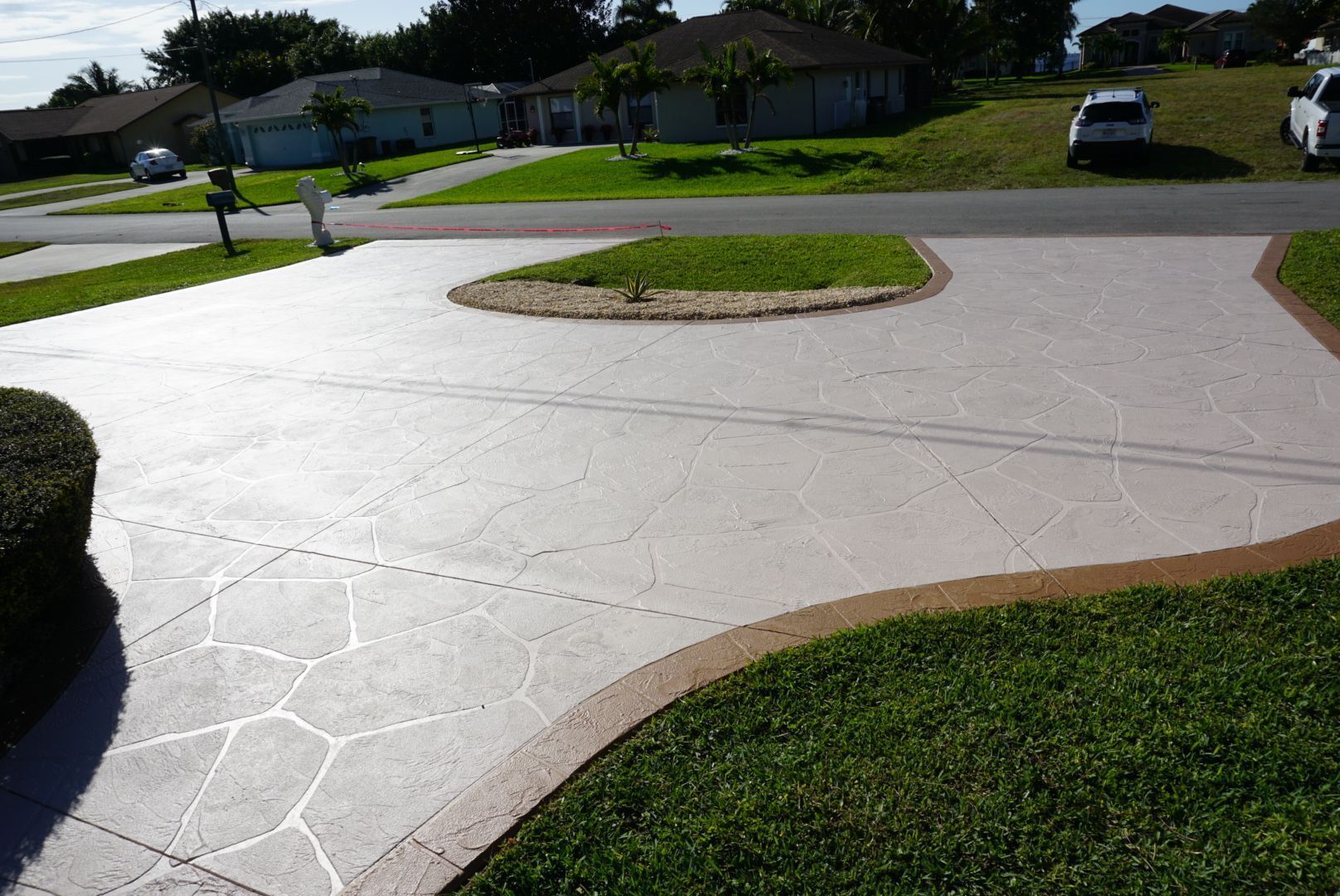 Solid color concrete sealant applied for durable and stylish flooring in Southwest Florida homes and businesses.