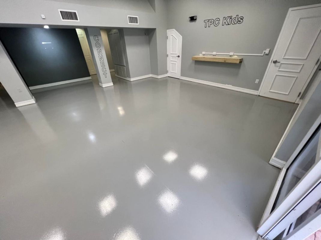 Durable commercial epoxy flooring in Cape Coral warehouse by The Epoxy Kingz.