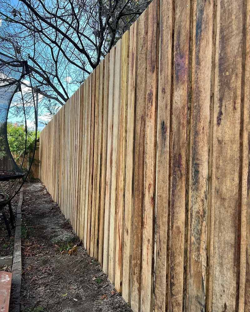 Wooden Fence, Light Brown With Vertical Planks Outdoors — CLF Landscapes in Woden, ACT