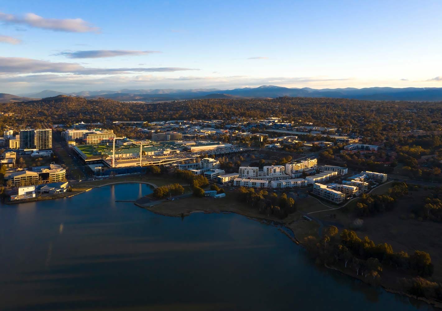 Aerial View of a Lakeside City With Buildings and a Stadium — CLF Landscapes in Belconnen, ACT