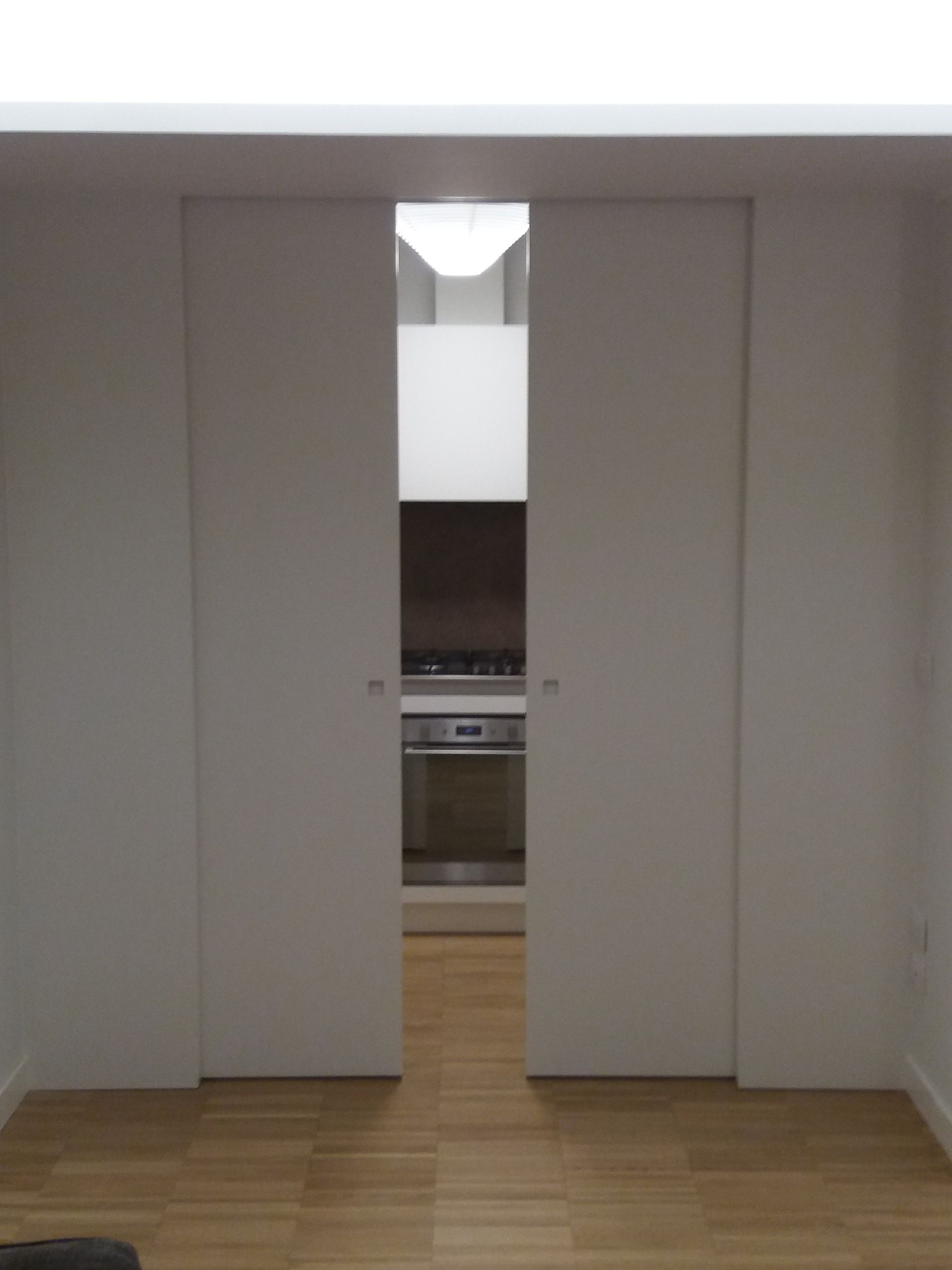 porte interne scorrevoli in legno laccato bianco