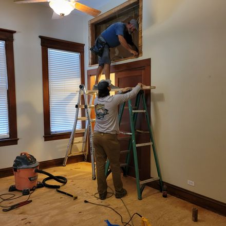 Crew making repairs after water damage in central Louisiana home.