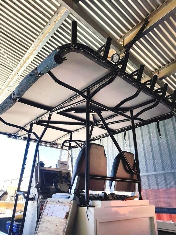 A boat with a canopy on top of it