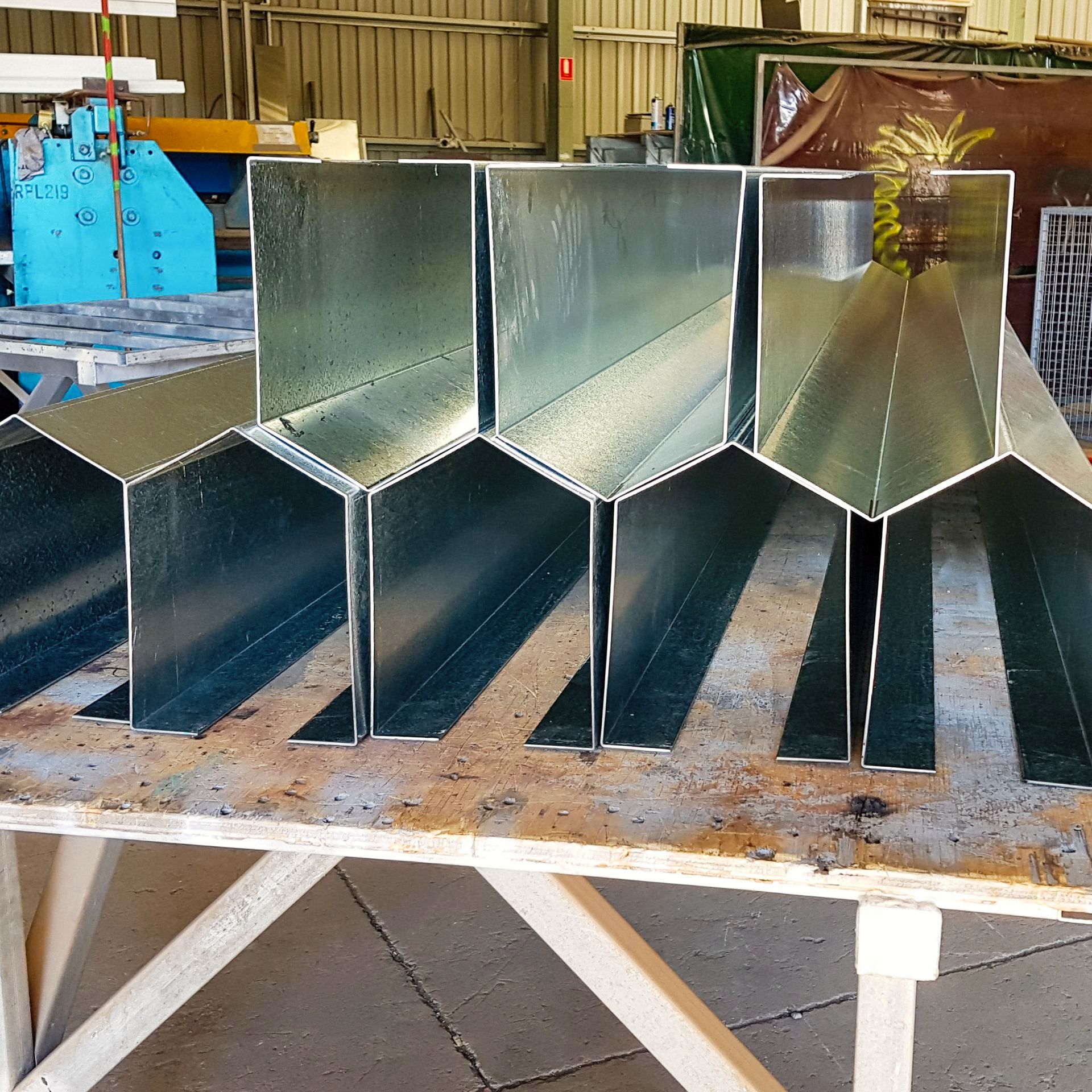 A bunch of metal tubes are lined up on a table
