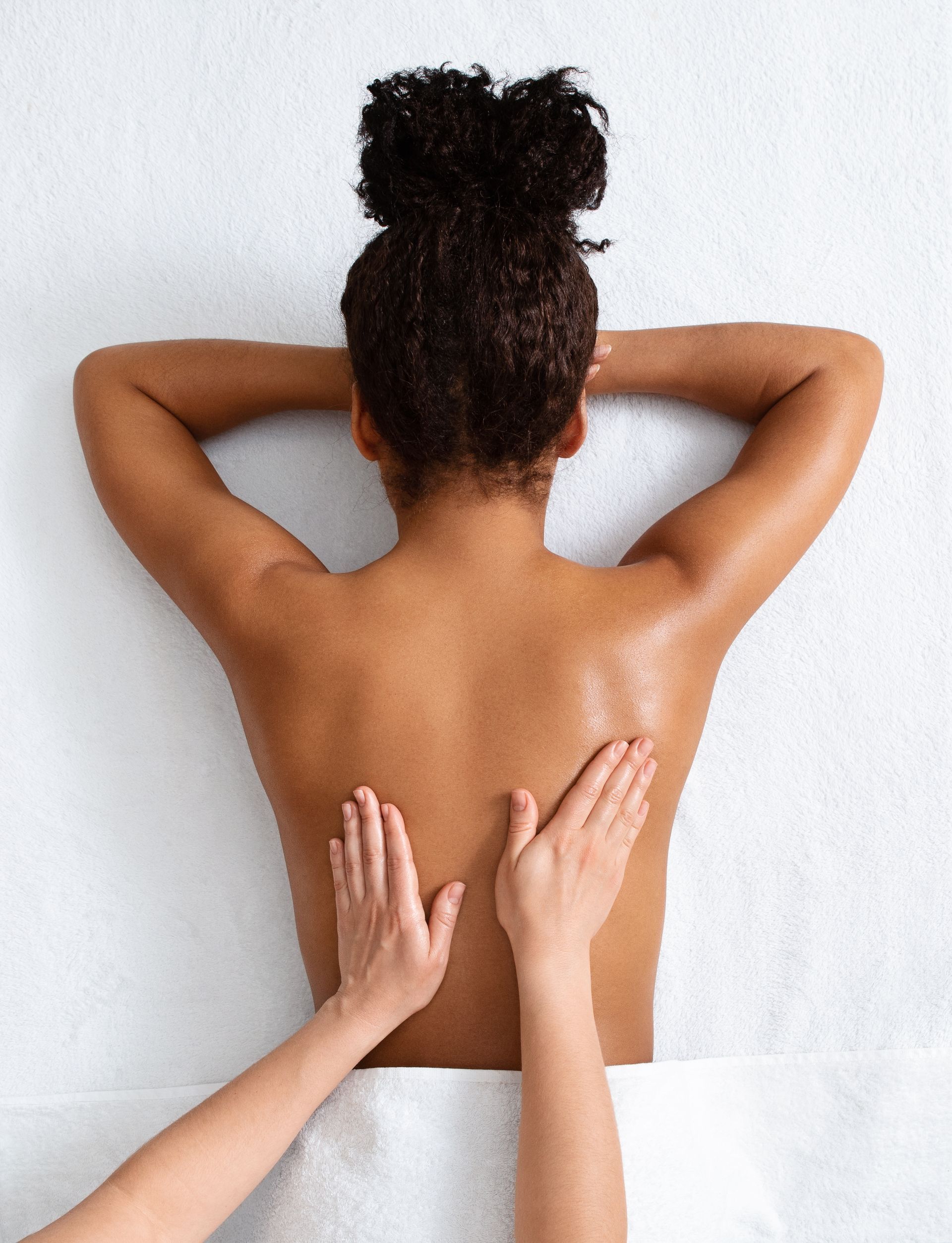 a woman is getting a massage on her back at a spa .