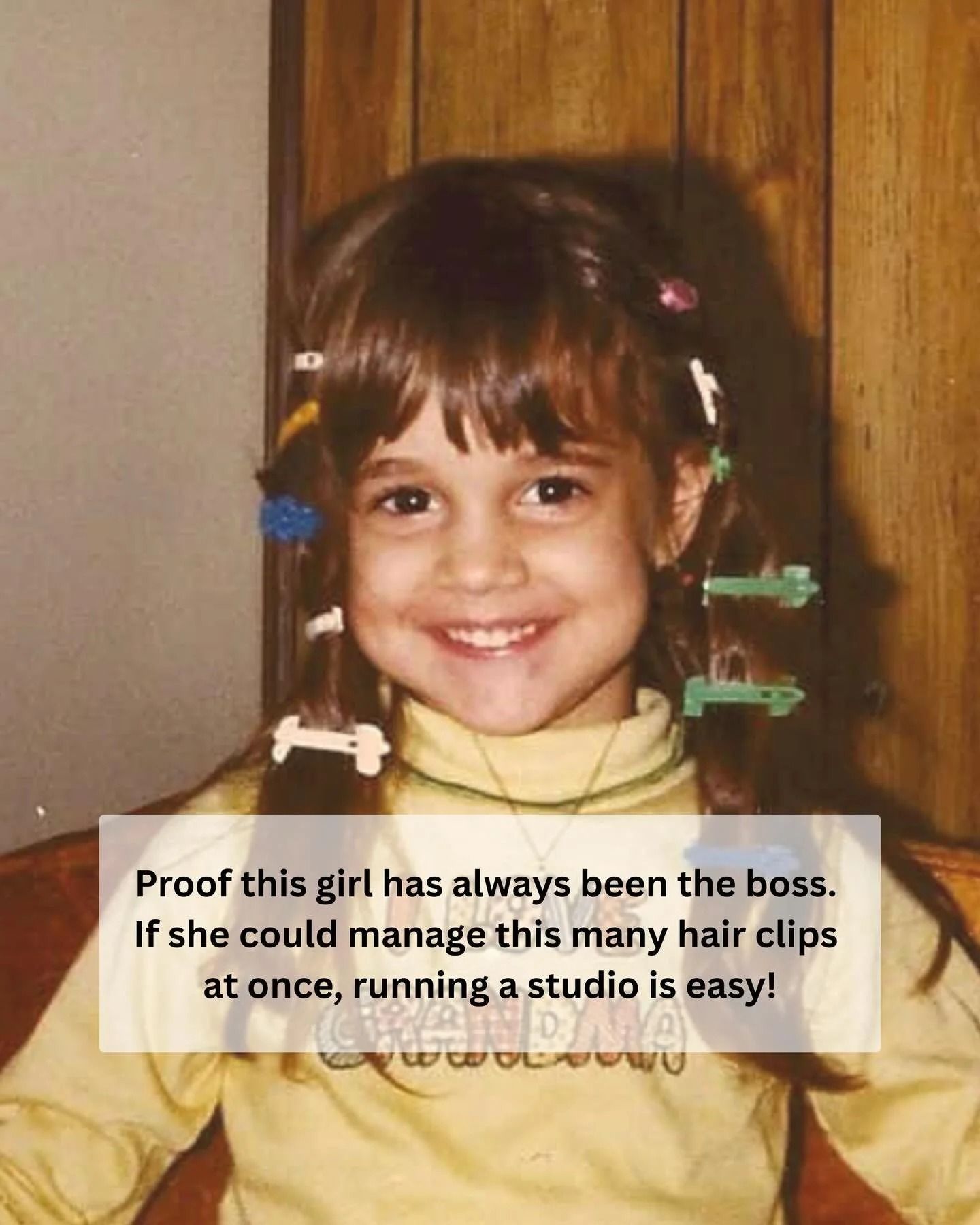 A smiling child wears a yellow turtleneck and numerous colorful hair clips, with text overlaid about managing a studio.