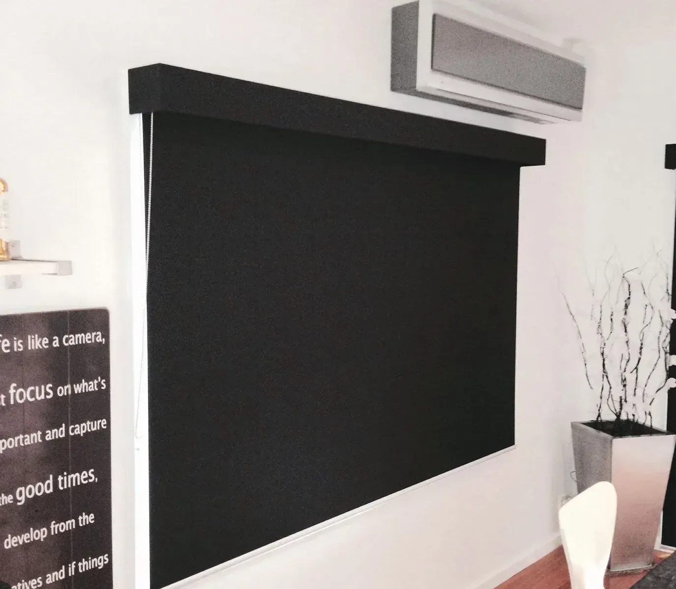 A Sign On A Wall That Says It Is Like A Camera — Spring Crest Blinds, Awnings & Security Doors in Melbourne, VIC