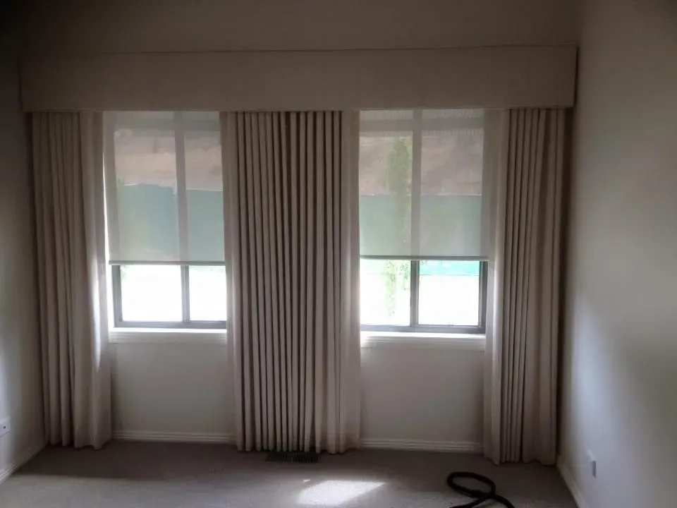 A Room With Two Windows And Curtains On Them — Spring Crest Blinds, Awnings & Security Doors in Melbourne, VIC