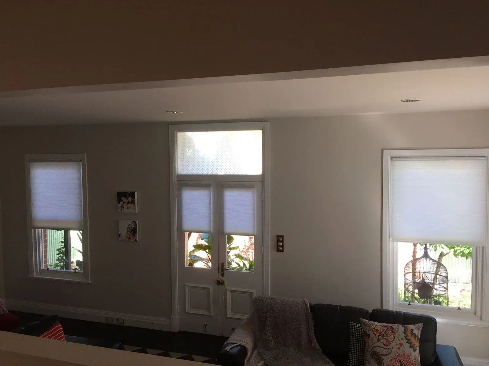 A Living Room With A Couch , Chair , And Two Windows — Spring Crest Blinds, Awnings & Security Doors in Ballarat, VIC