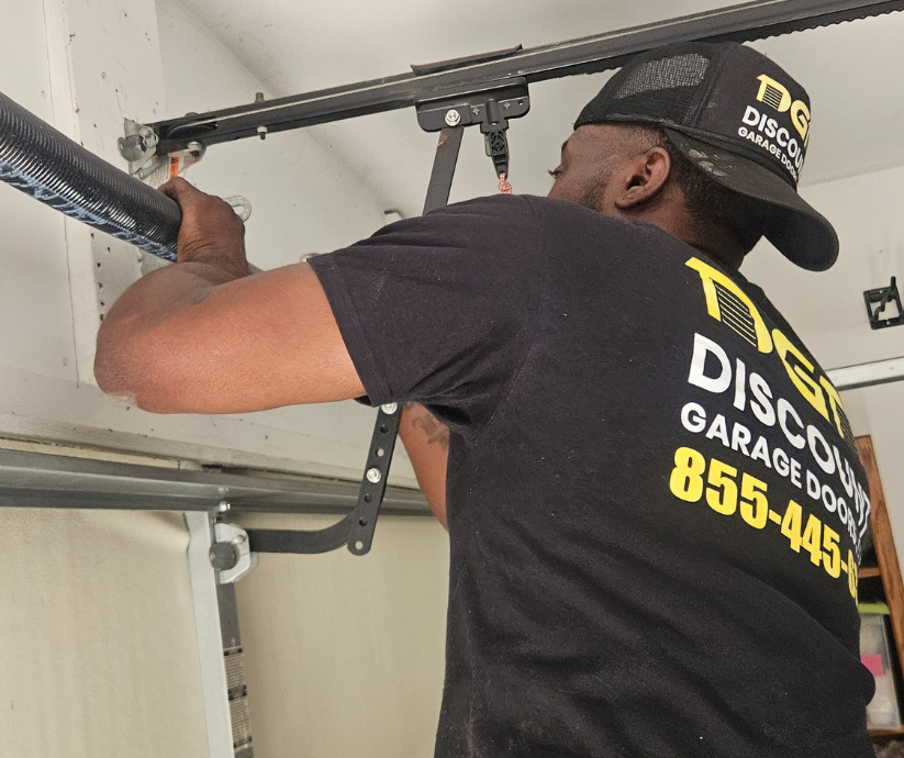 tech fixing garage door spring in dalls