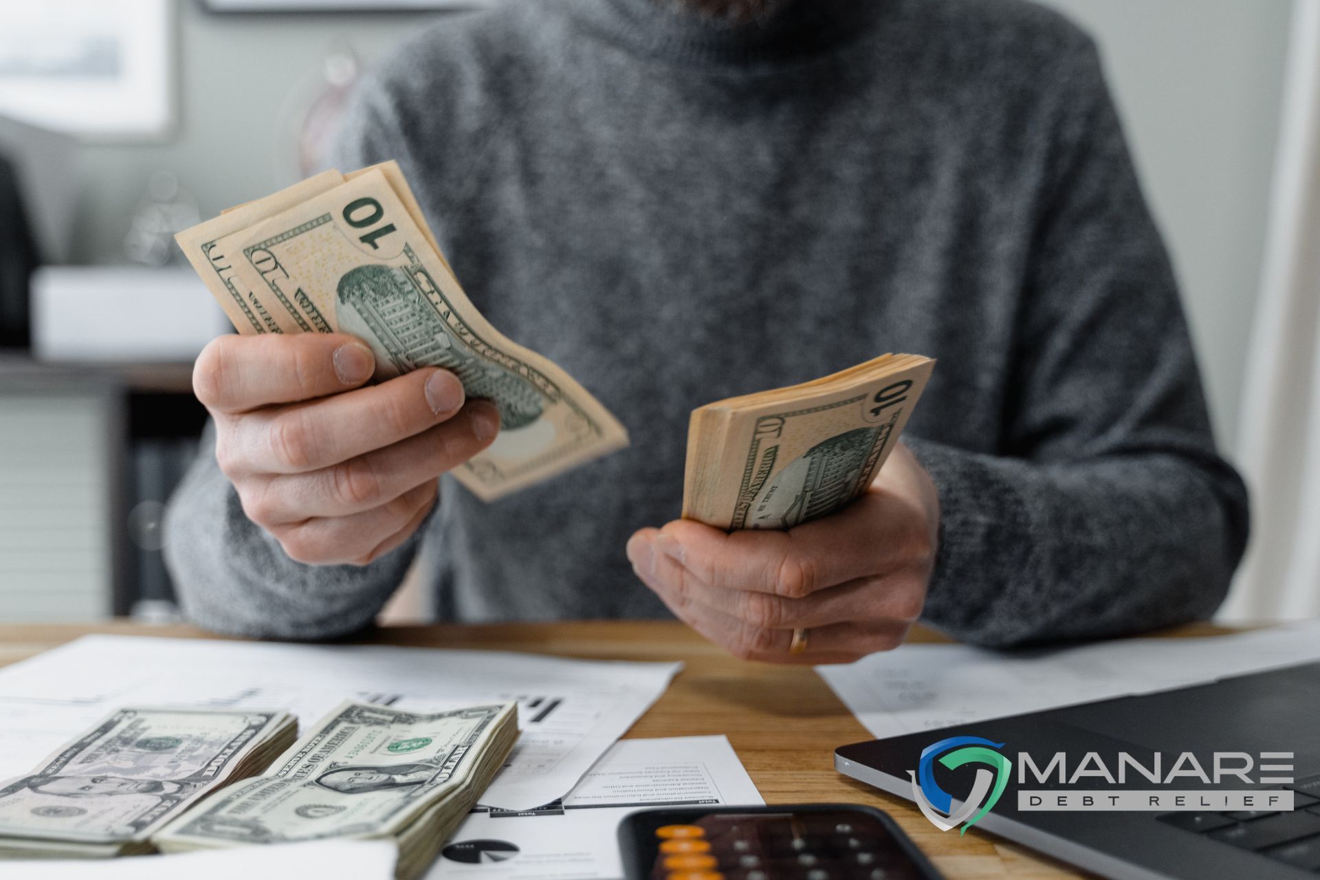 men counting money dollars bills