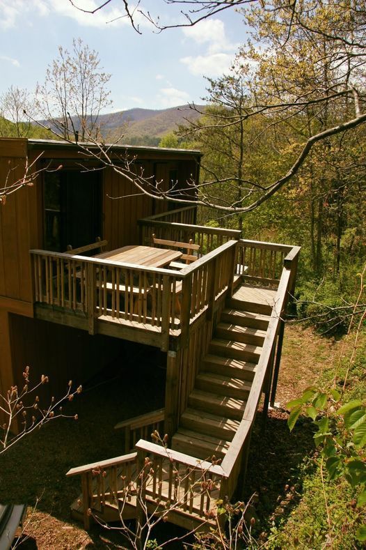 A wooden deck with stairs leading up to it