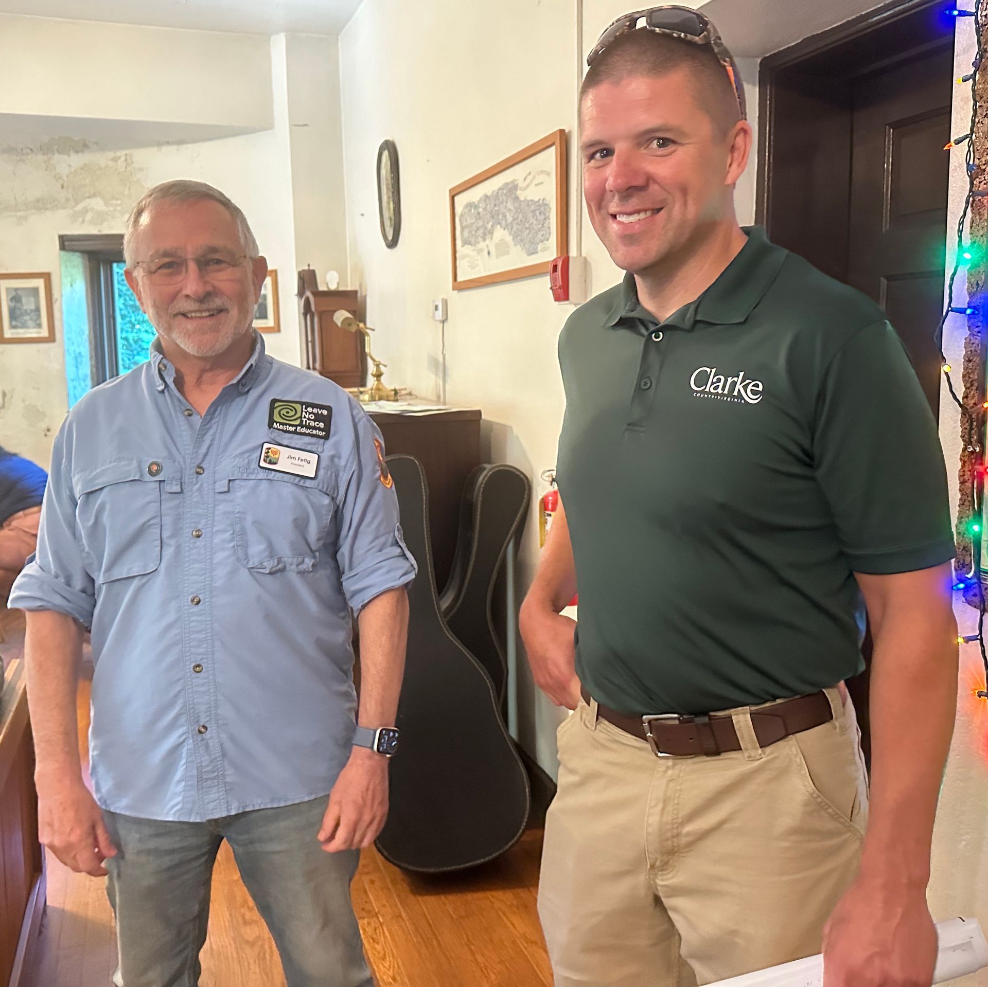 Two men standing next to each other with one wearing a shirt that says civic