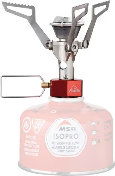 A msr stove is sitting on top of a pink gas cylinder.