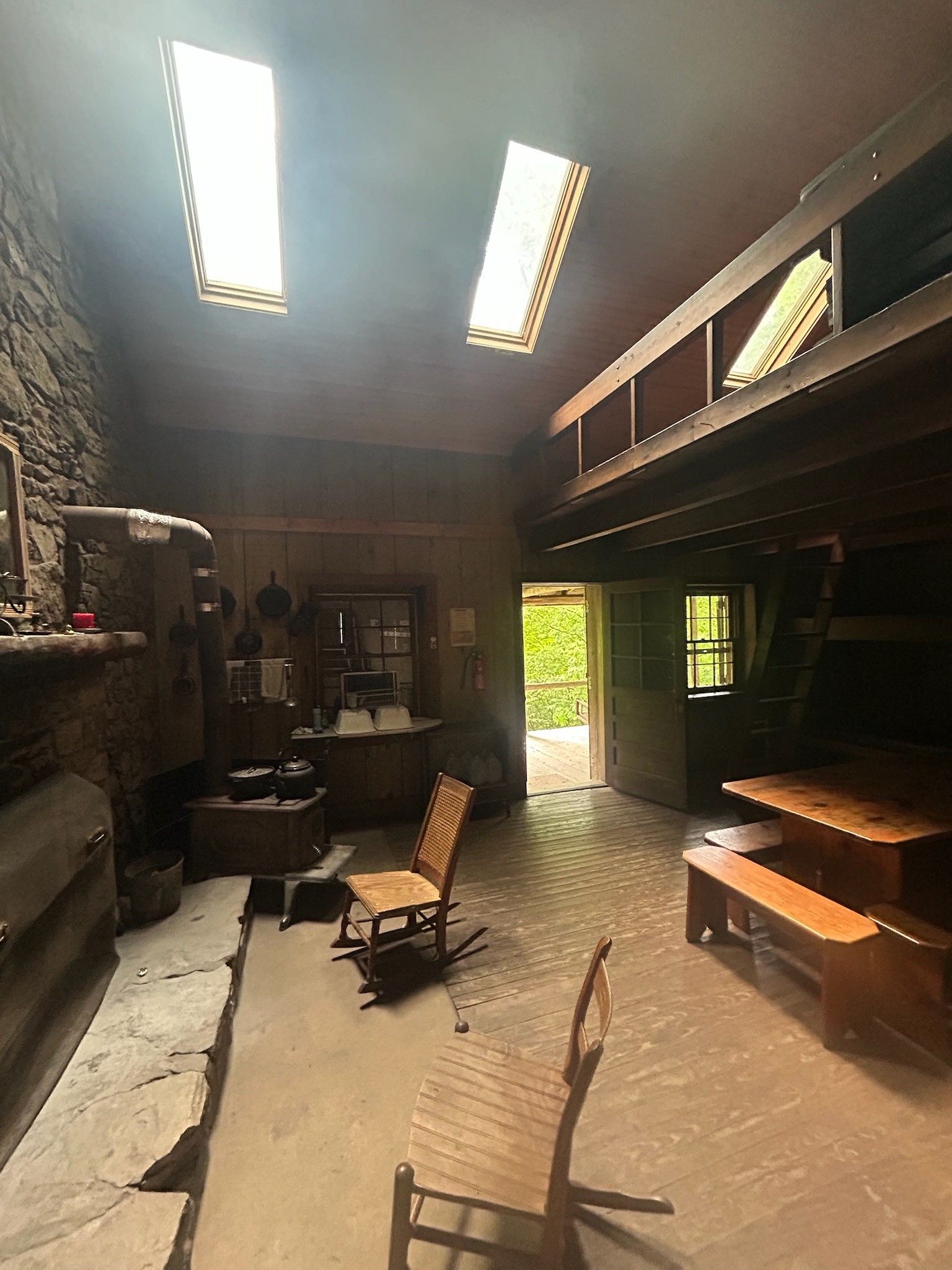 There is a rocking chair in the middle of the room.