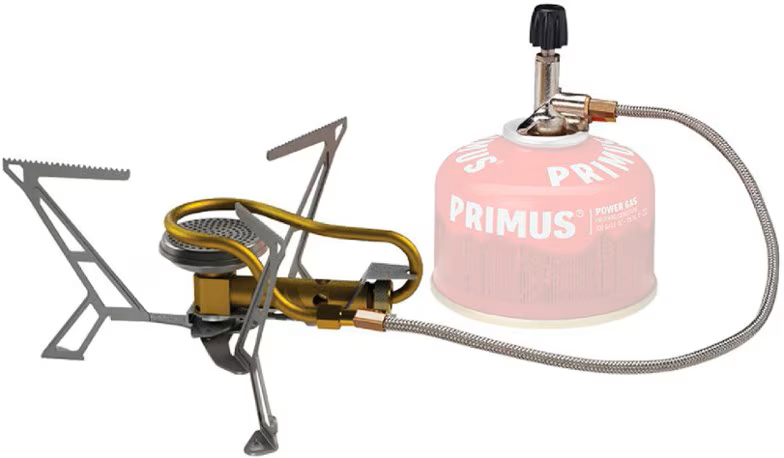 A primus gas stove with a hose attached to it.