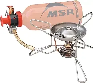 A stove with a bottle of gas attached to it.