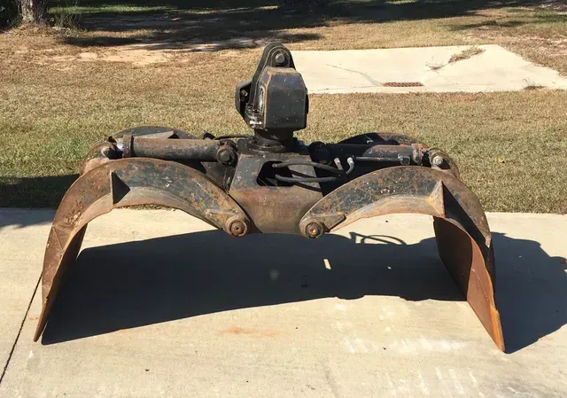 A large metal object is sitting on a concrete surface.