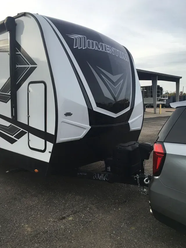 A black and white trailer with the word momentum on it