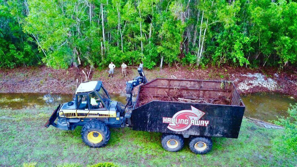 An aerial view of a tractor with a trailer attached to it.