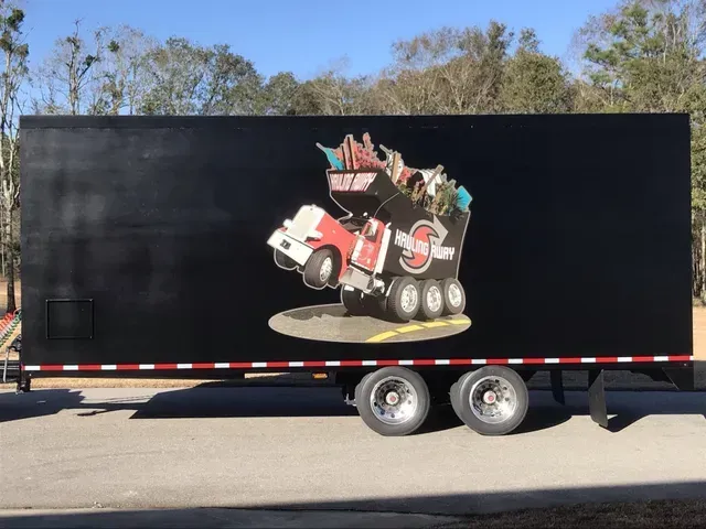A black trailer with a picture of a truck on it