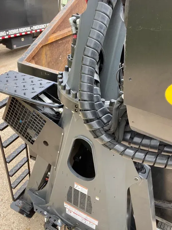 A close up of a machine with a hose attached to it.