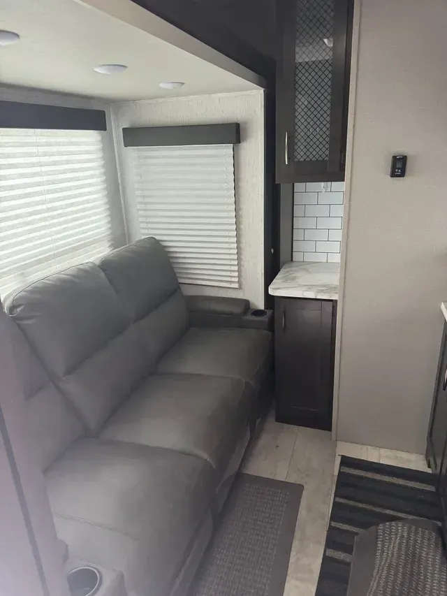 There is a couch in the middle of the room.