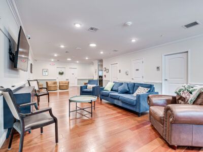 A living room filled with furniture and a flat screen tv.