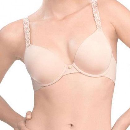 Beige bra on a person; lace straps, rounded cups.