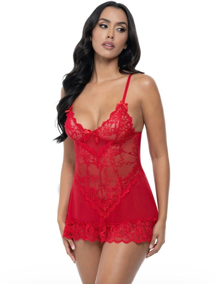 Woman in red lace lingerie; low-cut, spaghetti straps, standing.
