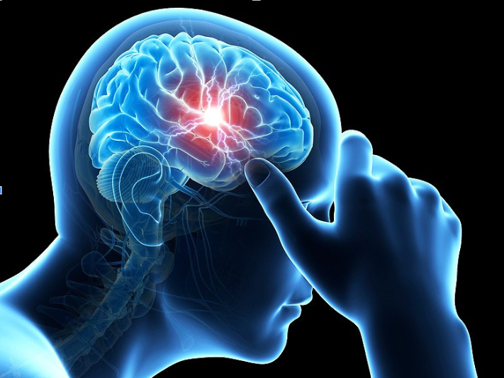A drawing of a person 's brain with a red spot on it