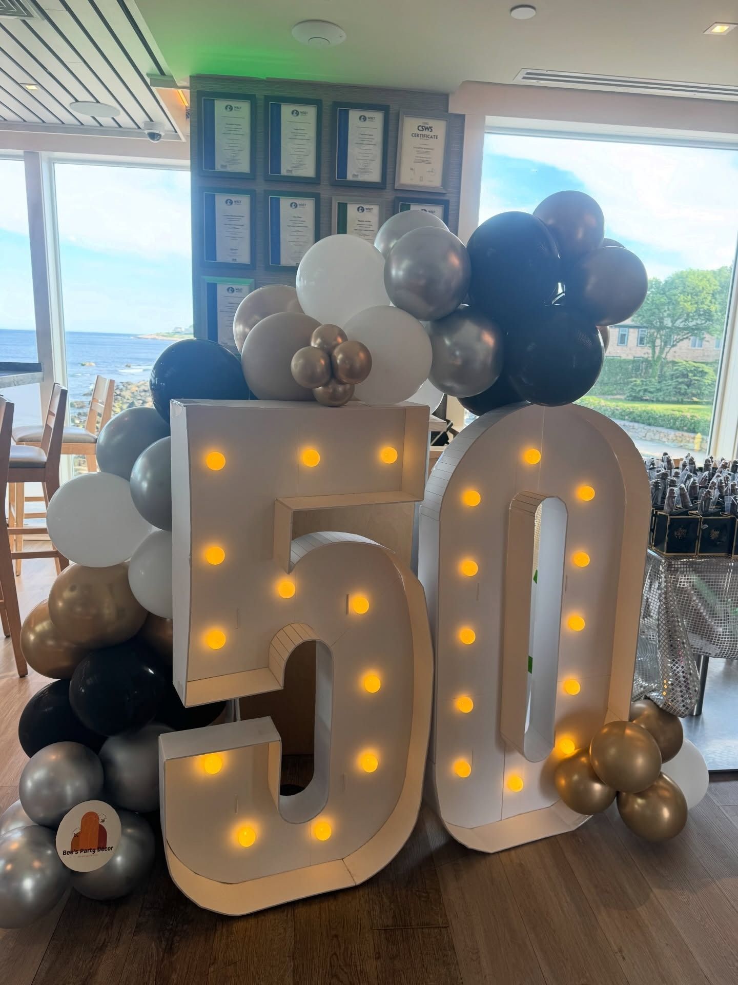 Illuminated 50th anniversary balloon display, gold and black, Rhode Island event decor