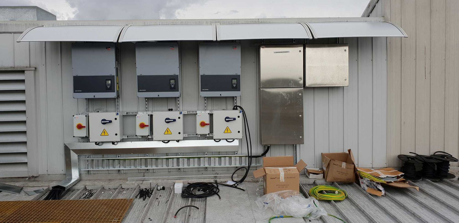 A Building With a Lot of Electrical Equipment on the Roof — Sapphire City Solar & Electrical In Inverell, NSW