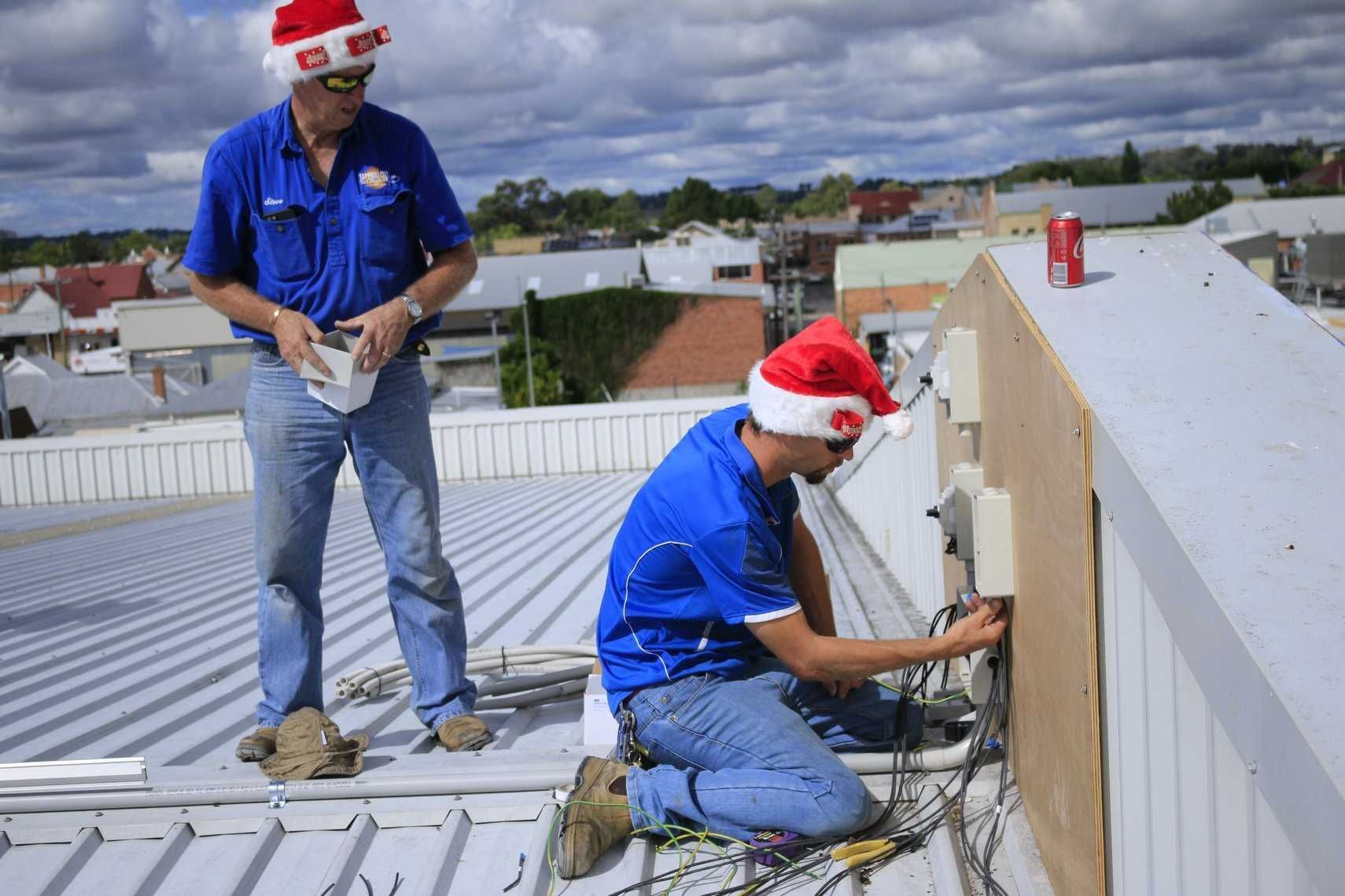 Two Men Are Working on a Roof β Sapphire City Solar & Electrical In Inverell, NSW
