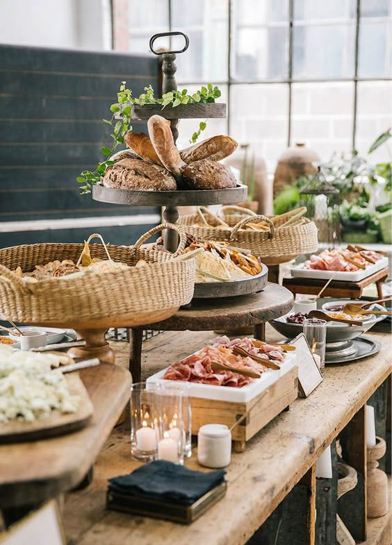 A buffet table with a variety of food on it.