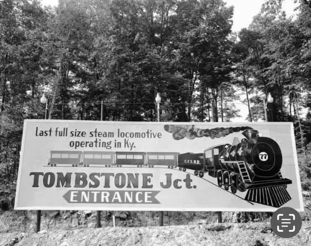 Sign for Tombstone Jct. entrance with steam locomotive illustration in black and white