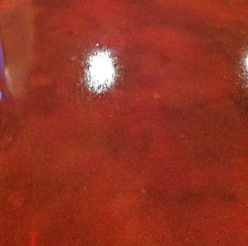 Red, glossy surface with bright white highlights.
