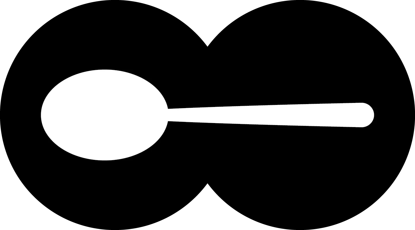 A black and white circle with a spoon in the middle.