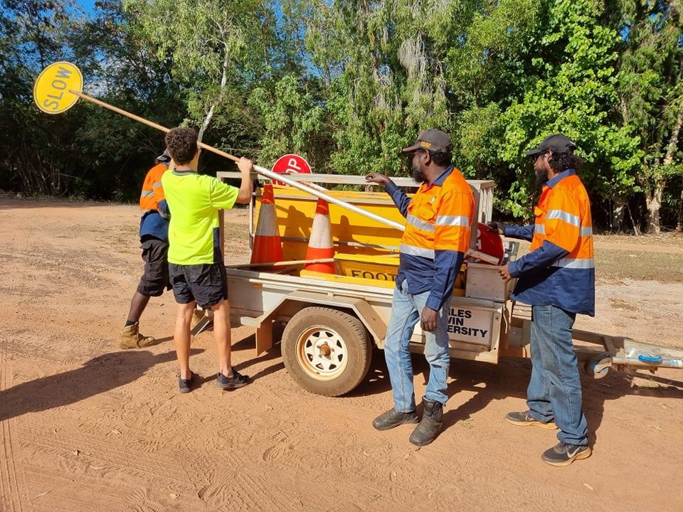 Four people installing a