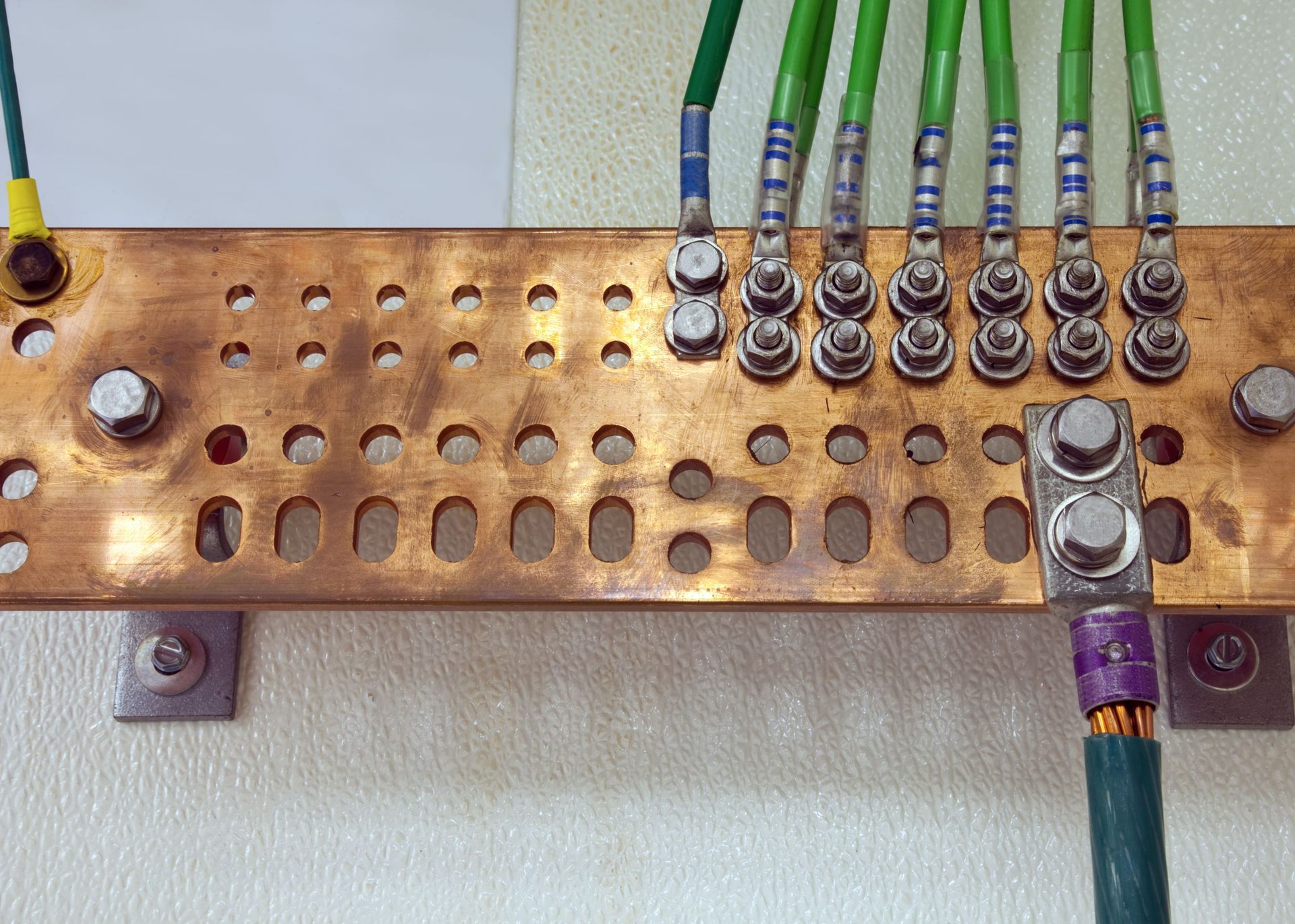 A bunch of wires are connected to a copper plate