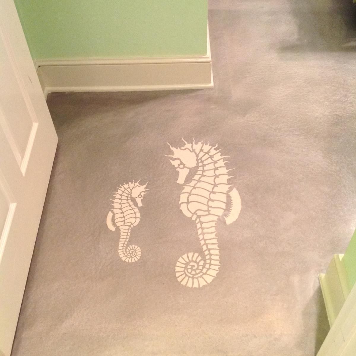Textured sprayed seahorses on a metallic reflector concrete floor. 