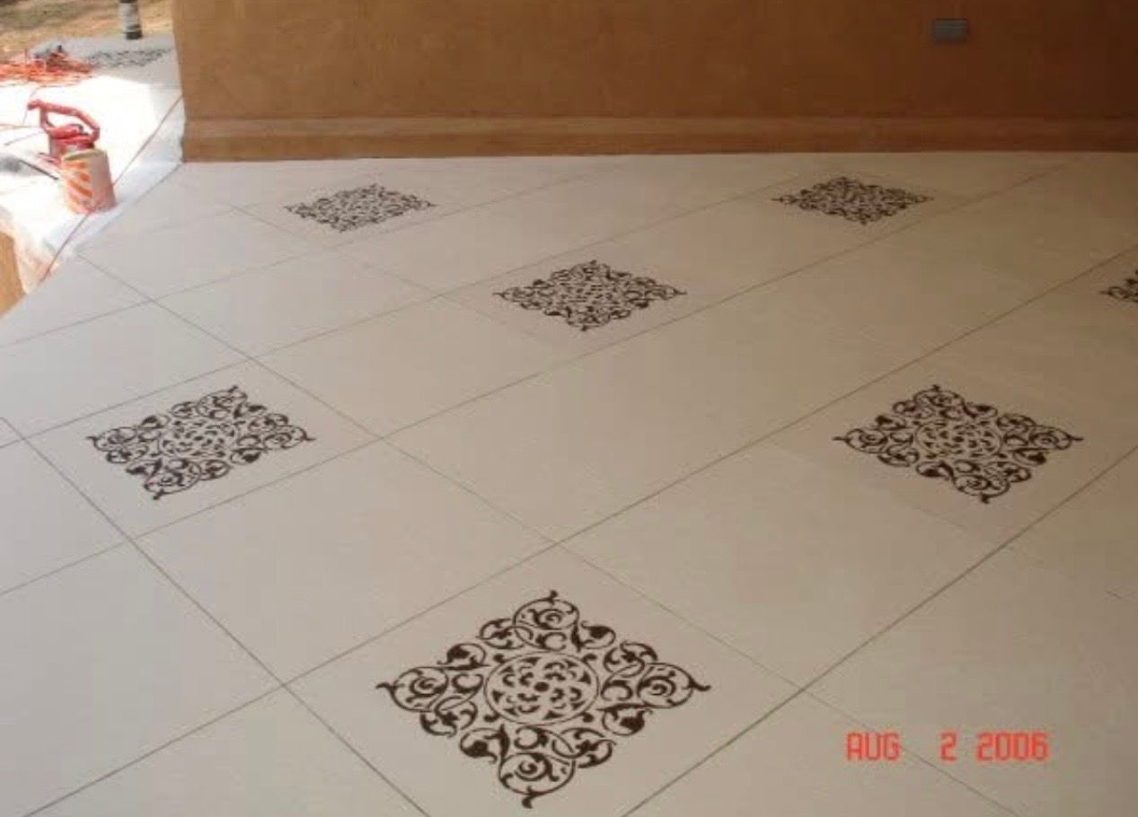 Concrete stain with textured sprayed accents