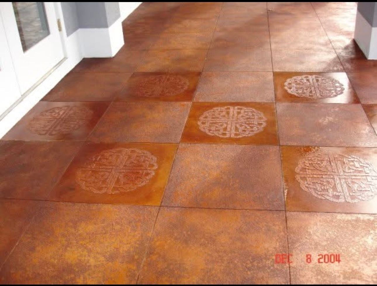 Acid staining resurface concrete tile design withtextured accents.