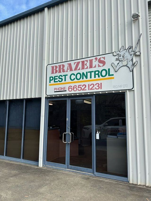 Sign For Brazel's Pest Control With Cartoon Bug — Brazel's Pest Control in Coffs Harbour, NSW